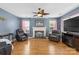 Cozy living room with a brick fireplace, wood floors, and comfortable seating at 126 Rocky Trail Ct, Fort Mill, SC 29715