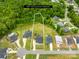 Aerial view showcasing property lines, a spacious lot surrounded by lush greenery, and neighboring houses at 126 Still Creek Dr, Mooresville, NC 28115