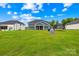 Expansive backyard with lush green lawn and a view of the home's exterior at 126 Still Creek Dr, Mooresville, NC 28115
