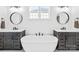 Bright bathroom features dual vanities, a soaking tub, and contemporary lighting fixtures at 126 Still Creek Dr, Mooresville, NC 28115