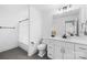 Clean, well-lit bathroom features a white vanity, mirror, and shower with a curtain at 126 Still Creek Dr, Mooresville, NC 28115