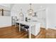 Bright kitchen features a large island, stainless steel appliances, and hardwood floors at 126 Still Creek Dr, Mooresville, NC 28115