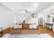 Bright, open-concept living room with hardwood floors, staircase, and modern finishes at 126 Still Creek Dr, Mooresville, NC 28115