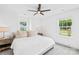 Bright and airy bedroom features soft carpet, two windows, and a ceiling fan at 126 Still Creek Dr, Mooresville, NC 28115