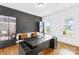 Modern office with a unique accent wall, hardwood floors, and bright natural light at 126 Still Creek Dr, Mooresville, NC 28115
