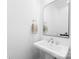 Stylish powder room with a pedestal sink, modern faucet, and neutral decor at 126 Still Creek Dr, Mooresville, NC 28115