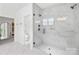 Modern shower includes a sleek frameless door and marble tiling at 126 Still Creek Dr, Mooresville, NC 28115