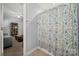 Bathroom featuring a shower with a decorative curtain, enhancing the bathing experience at 12663 Windyedge Rd, Huntersville, NC 28078