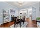 Charming dining area featuring a wooden table, stylish decor, and convenient access to the kitchen at 12663 Windyedge Rd, Huntersville, NC 28078