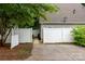 Wide driveway leading to a fenced backyard, providing ample parking and outdoor access at 12663 Windyedge Rd, Huntersville, NC 28078