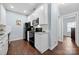 The kitchen features white cabinets and a black appliance suite including a range, microwave, and refrigerator at 12663 Windyedge Rd, Huntersville, NC 28078