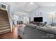 Inviting living room featuring an open floor plan, high ceilings, and hardwood floors at 12663 Windyedge Rd, Huntersville, NC 28078