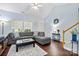 Cozy living room with a comfortable sectional sofa, hardwood floors, and welcoming decor at 12663 Windyedge Rd, Huntersville, NC 28078