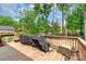Large wooden deck and treeline view, with ample space for outdoor enjoyment at 1316 Wiscassett St, Albemarle, NC 28001