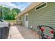 Wooden back deck with home access, and some items stored on the deck at 1316 Wiscassett St, Albemarle, NC 28001