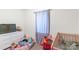 Comfortable bedroom features light-colored walls, a white dresser, and a crib with toys and bedding at 1316 Wiscassett St, Albemarle, NC 28001