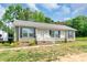 Charming single-story house with a well-maintained lawn and front porch at 1316 Wiscassett St, Albemarle, NC 28001