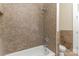 Bathroom with modern shower and white tub complemented by tiled wall and floors at 135 Waycross Dr, Rockwell, NC 28110