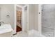 Bathroom featuring a shower and doorway to shelving at 135 Waycross Dr, Rockwell, NC 28110