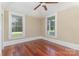 Bedroom with hardwood floors, ceiling fan and double windows at 135 Waycross Dr, Rockwell, NC 28110