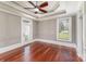Spacious bedroom features tray ceiling, ceiling fan, and beautiful hardwood floors at 135 Waycross Dr, Rockwell, NC 28110