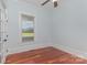 Bedroom with wood floors, and window with outdoor views at 135 Waycross Dr, Rockwell, NC 28110