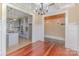 View of kitchen with gray cabinets, and hardwood floors with classic white wainscoting at 135 Waycross Dr, Rockwell, NC 28110