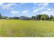 Sprawling lawn and exterior view with pool, gazebo and detached shed at 135 Waycross Dr, Rockwell, NC 28110