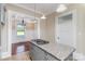 Bright kitchen showcasing granite countertops and a gas cooktop on the center island at 135 Waycross Dr, Rockwell, NC 28110