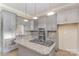 Modern kitchen with stainless steel appliances, gray cabinets, granite countertops, and tile backsplash at 135 Waycross Dr, Rockwell, NC 28110
