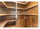 Wooden pantry with shelving and pull-out storage at 135 Waycross Dr, Rockwell, NC 28110