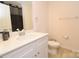 Bathroom with a toilet, mirror, countertop, and sink at 1365 Eagle Claw Dr, Kannapolis, NC 28083