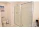 Bathroom featuring a toilet, chrome shower and a shower with sliding glass door at 1365 Eagle Claw Dr, Kannapolis, NC 28083