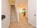 Inviting foyer with hardwood floors and staircase, seamlessly connecting to an open-concept living and kitchen area at 1365 Eagle Claw Dr, Kannapolis, NC 28083