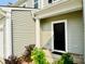 Close-up of the front entrance with lush greenery, showing the home's inviting curb appeal and neat landscaping at 1365 Eagle Claw Dr, Kannapolis, NC 28083