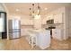 Spacious kitchen with modern stainless steel appliances, center island, and subway tile backsplash at 1365 Eagle Claw Dr, Kannapolis, NC 28083
