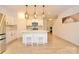 Beautiful kitchen with island seating, modern appliances, and stylish pendant lighting at 1365 Eagle Claw Dr, Kannapolis, NC 28083