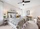 This bedroom features a decorative rug, ceiling fan and light fixture and natural lighting for a relaxing stay at 14128 Morningate St, Huntersville, NC 28078