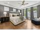 Relaxing bedroom with neutral tones, tray ceiling, and natural light from large windows at 14128 Morningate St, Huntersville, NC 28078