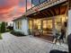 Outdoor patio with comfortable seating and a view into the home's kitchen at 14128 Morningate St, Huntersville, NC 28078