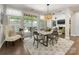 Cozy dining area with a sliding glass door leading to the outdoor patio at 14128 Morningate St, Huntersville, NC 28078