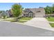 Charming home featuring a landscaped front yard, and stylish architectural details at 14128 Morningate St, Huntersville, NC 28078