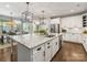 Spacious kitchen featuring a large island, stainless appliances, and views into other rooms at 14128 Morningate St, Huntersville, NC 28078