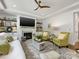 Warm living room with a fireplace, built-in shelves, hardwood floors, and a comfortable seating area at 14128 Morningate St, Huntersville, NC 28078