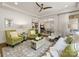 Bright and airy living room featuring hardwood floors, neutral tones, and open access to other living spaces at 14128 Morningate St, Huntersville, NC 28078