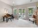 Bright office space featuring a desk, comfortable seating, and access to an outdoor patio at 14128 Morningate St, Huntersville, NC 28078