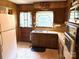 This kitchen offers a double sink, wood cabinets, and lots of natural light from the window above the sink at 1460 Legion Rd, Fort Mill, SC 29715