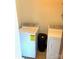 Efficient laundry room with a washer, dryer, and black trash receptacle at 1460 Legion Rd, Fort Mill, SC 29715