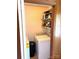 This laundry area features a washer, dryer, black trash receptacle and shelving above at 1460 Legion Rd, Fort Mill, SC 29715