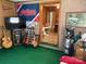 Fun-filled living room with indoor putting green, sports memorabilia, and an open doorway to the dining area at 1460 Legion Rd, Fort Mill, SC 29715